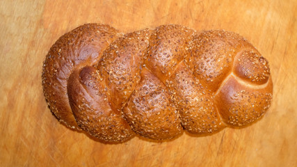 Aufkleber - wheat bread with sesame seeds lies on a cutting board
