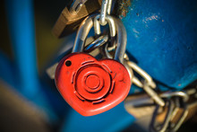 A Rusty Red Love Lock With A Heart
