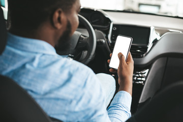 Man Using Phone With Empty Screen Sitting In Car, Back-View