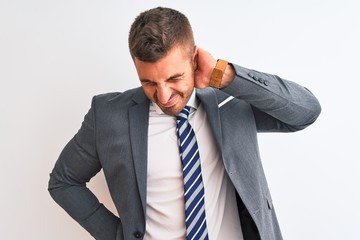 Canvas Print - Young handsome business man wearing suit and tie over isolated background Suffering of neck ache injury, touching neck with hand, muscular pain