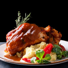 Wall Mural - Delicious roasted pork knuckle  with mashed potatoes on a plate.