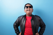 Happy Success Fat Asian Boy Wearing Leather Jacket And Sunglasses Shows Winning Gesture