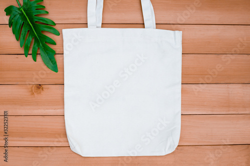 Download Tote Bag Canvas Fabric Cloth Shopping Sack Mockup Blank On Wood Backgroung Buy This Stock Photo And Explore Similar Images At Adobe Stock Adobe Stock Yellowimages Mockups