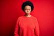 © Krakenimages.com - Young beautiful African American afro woman with curly hair wearing casual sweater depressed and worry for distress, crying angry and afraid. Sad expression.