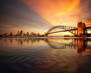 view point of sydney harbour with city and bridge in sunset time
