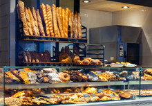 Bakery Shop With Assortment Of Bread On Shelves