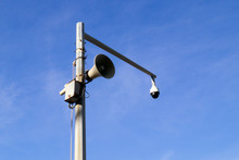 Loudspeaker And Surveillance Camera On A Pillar