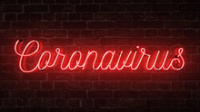 Bright Red Neon Sign That Says The Word Coronavirus On A Brick Wall.