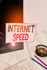 Poster - Handwriting text writing Internet Speed. Conceptual photo the rate which internet connection is able to move or operate Note paper taped to black computer screen near keyboard and stationary