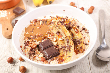 Poster - bowl of oatmeal, cereal porrdige with banana, nut and chocolate