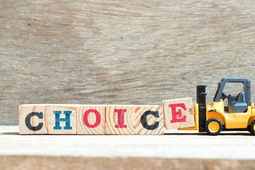 Poster - Toy forklift hold letter block e to complete word choice on wood background