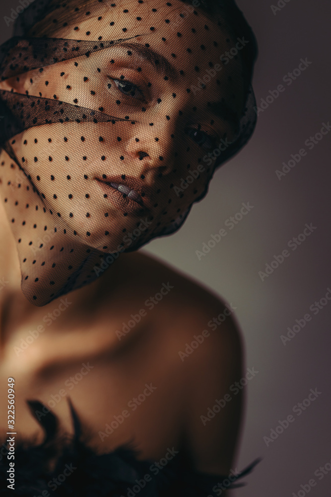 fashion portrait of beauty elegant girl posing in black veil on dark ...