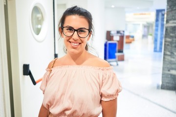 Poster - Beautiful girl smiling happy inside of hotel hall