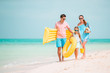 © travnikovstudio - Happy beautiful family with kids on the beach