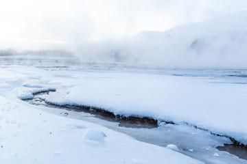 Wall Mural - Incredible winter landscape of Iceland. In winter, a source of hot water flows in the mountains