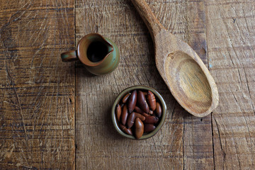 Wall Mural - Baru chestnut on the rustic wooden table