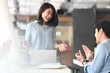 © Prathankarnpap - Business development team applauding to them boss while they finished discussing/meeting at the modern meeting table with comfortable meeting room as background.