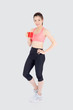 © NT_studio - Beautiful young asian woman in sport after workout drinking water from glass for thirsty isolated on white background, girl after exercise drink coffee or tea for hydration and refresh with healthy.