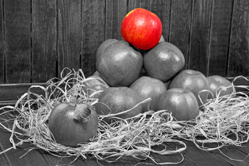 Wall Mural - one red apple on wooden table in black and white