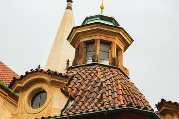 Prague, Czech Republic. 10.05.2019: Detail of the yellow facade of a historic building in the old town of beautiful Prague, Czech Republic. Golden hourly photograph. The sun shines on the facade.