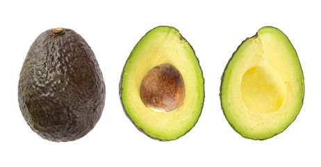 Whole ripe avocado fruit and two halves in a row isolated on white background.