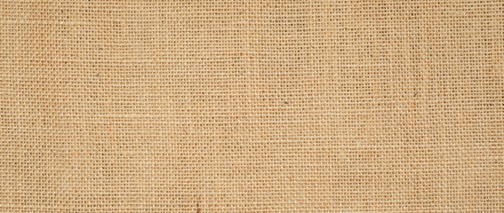 Wall Mural - Hessian sackcloth burlap woven texture background  / cotton woven fabric background with flecks of varying colors of beige and brown. with copy space. office desk concept.