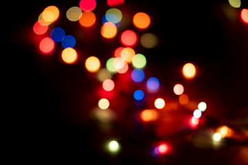 Wall Mural - abstract colorful bokeh lights of garland on the party celebration