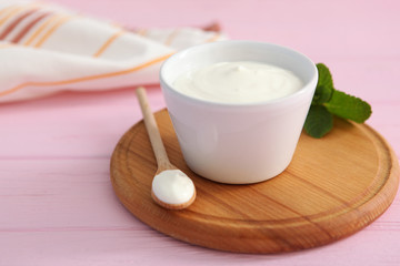 Wall Mural - Natural white yogurt on the table. Healthy snack, Greek yogurt.