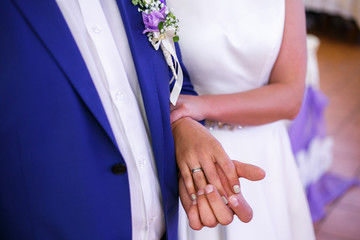 Wall Mural - bride holds the groom by the elbow