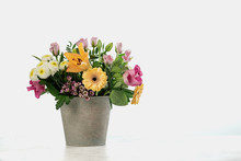 Bouquet Of Different Flowers In Metall Bucket On White Background