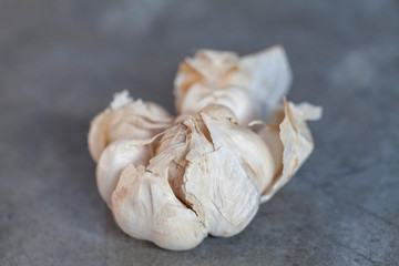 Organic raw garlic bulb. Shallow depth of field close up view.