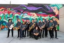 High School Jazz Band Musicians In Front Of Urban Graffiti Mural