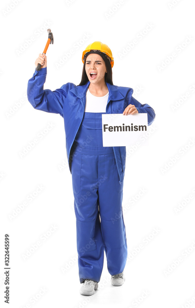 Female worker holding poster with text FEMINISM against white background