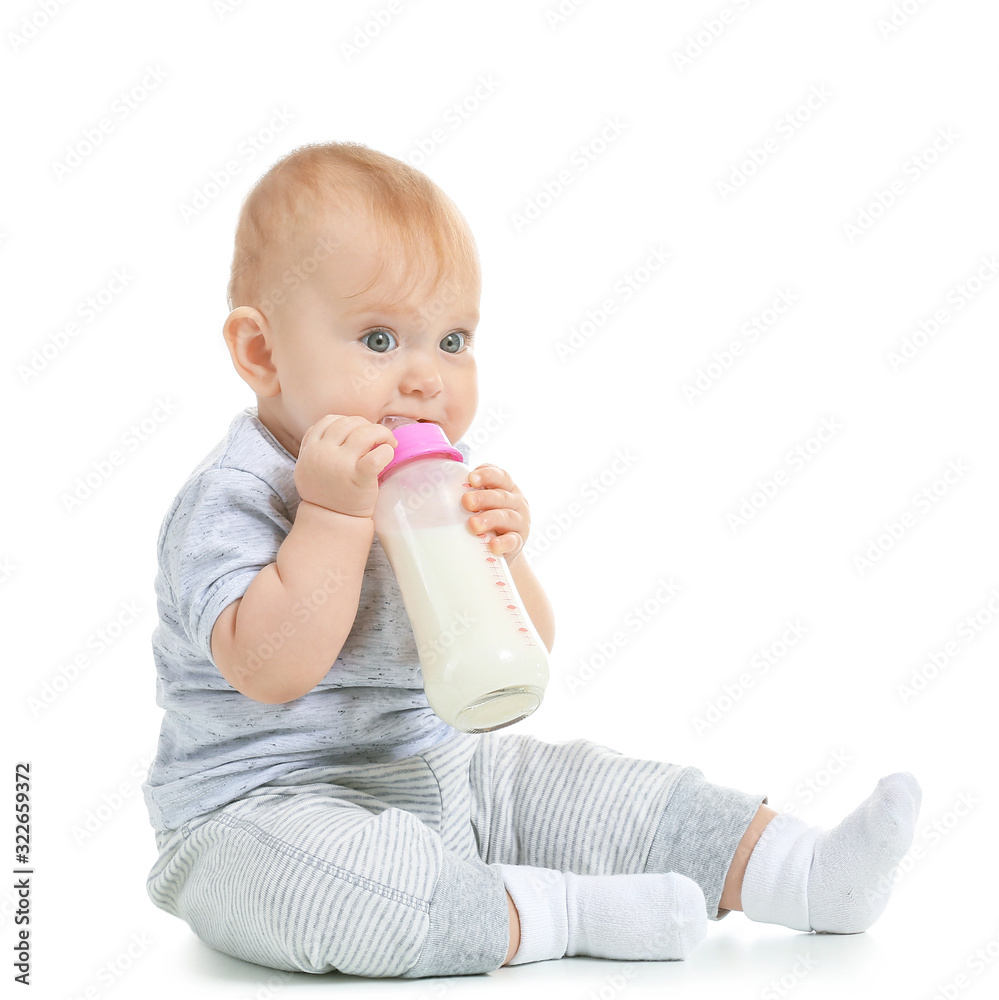 Baby with bottle of milk on white background