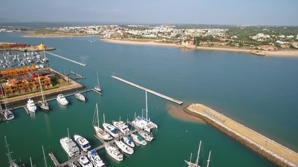 Canvas Print - Aerial. Aerial view of a Portuguese marina with yachts and motor boats, the city of Portimao.