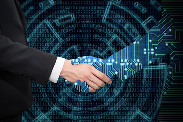 Businessman shaking hand with digital partners hand on green futuristic background.