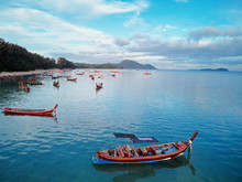 Travel Asia. Beautiful Tropical Seascape.Traditional Thai Longtail Boats In Blue Lagoon Rawai Beach In Phuket Island.