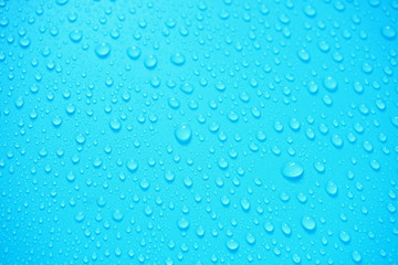 Water Drops On Blue Background.