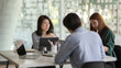 © bongkarn - Cropped shot of team application developer consulting on UI project