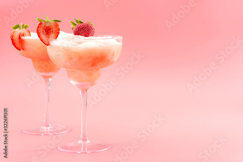 Mixed Cocktails Party Punch Smoothies And Frozen Summer Drinks Concept With Strawberry Mojito Or Daiquiri In Margarita Glasses And Fruits Used As Garnish Isolated On Pink Background With Copy Space Buy
