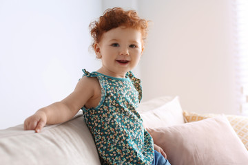 Poster - Portrait of cute little child on sofa at home