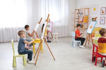 Poster - Cute little children painting during lesson in room