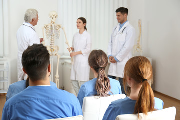 Canvas Print - Medical students having lecture in orthopedics at clinic