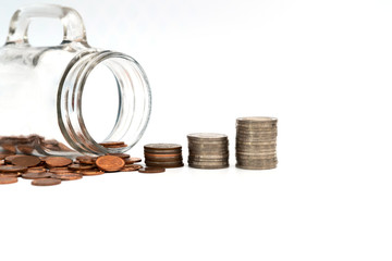 Step of coins stacks and  glass jar isolated on white background , money saving and investment or family planning concept.