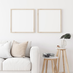 Two square wooden frame mock up with sofa and wooden side table on white wall in living room. 3D illustration.