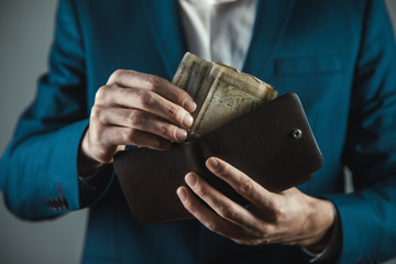 Wall Mural - business man hand money with wallet