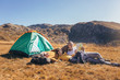 © Mediteraneo - Three generations of family camping together in the autumn.