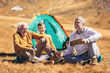 © Mediteraneo - Three generations of family camping together in the autumn.