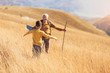© Mediteraneo - Senior man with grandson on country walk in autumn.