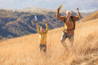 © Mediteraneo - Senior man with grandson on country walk in autumn.